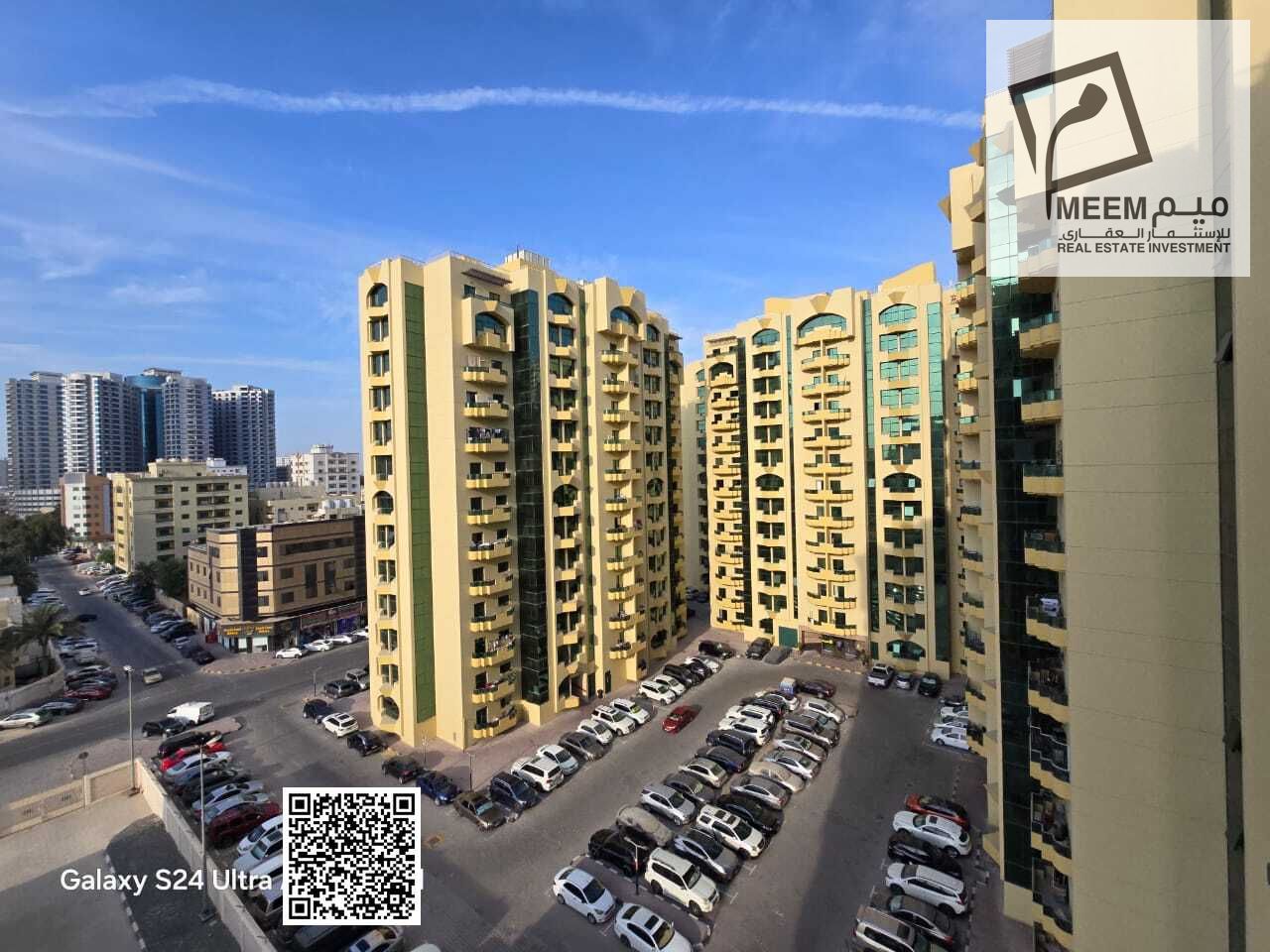 Two-bedroom apartment with a living room for sale in Al Rashidiya Towers, freehold ownership for all nationalities.