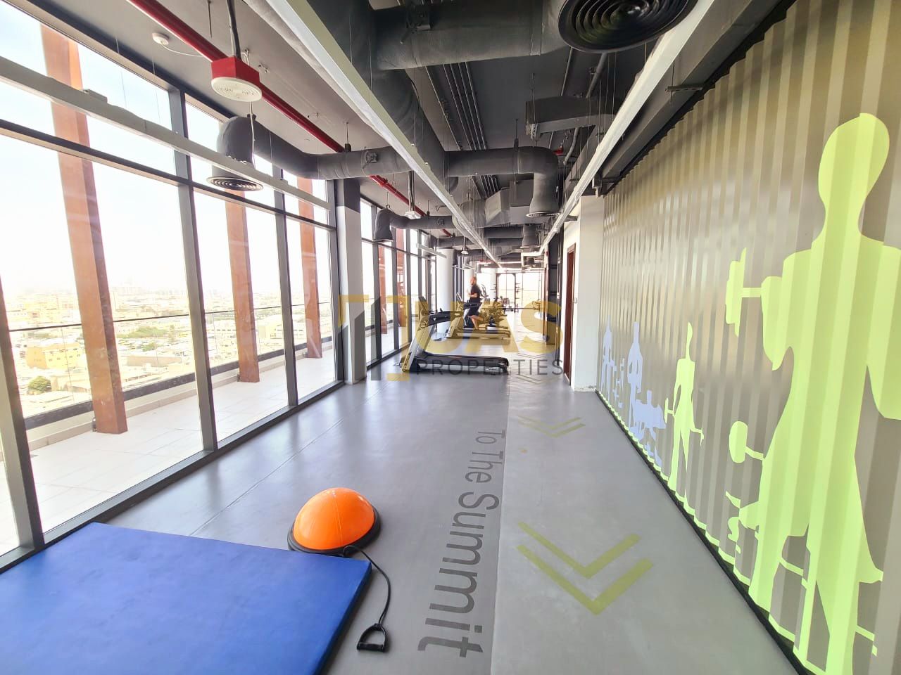 Lavish 1bhk just 4 munit walk Metro with gym pool parking free