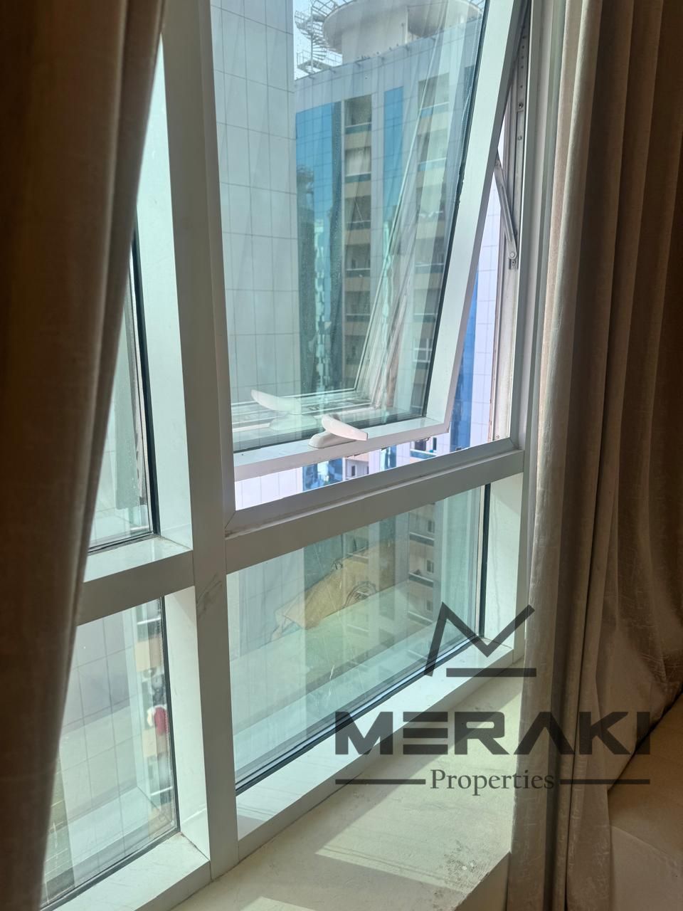 One-bedroom apartment with a living room for sale in Orient Towers, with parking, immediate handover, and very comfortable monthly installment of 4,72