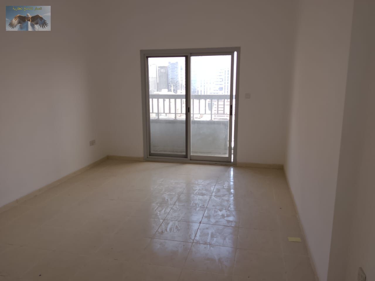 Beautiful two-bedroom apartment with a living room, in a prime location, elegant design, and easy access to Dubai and Sharjah.