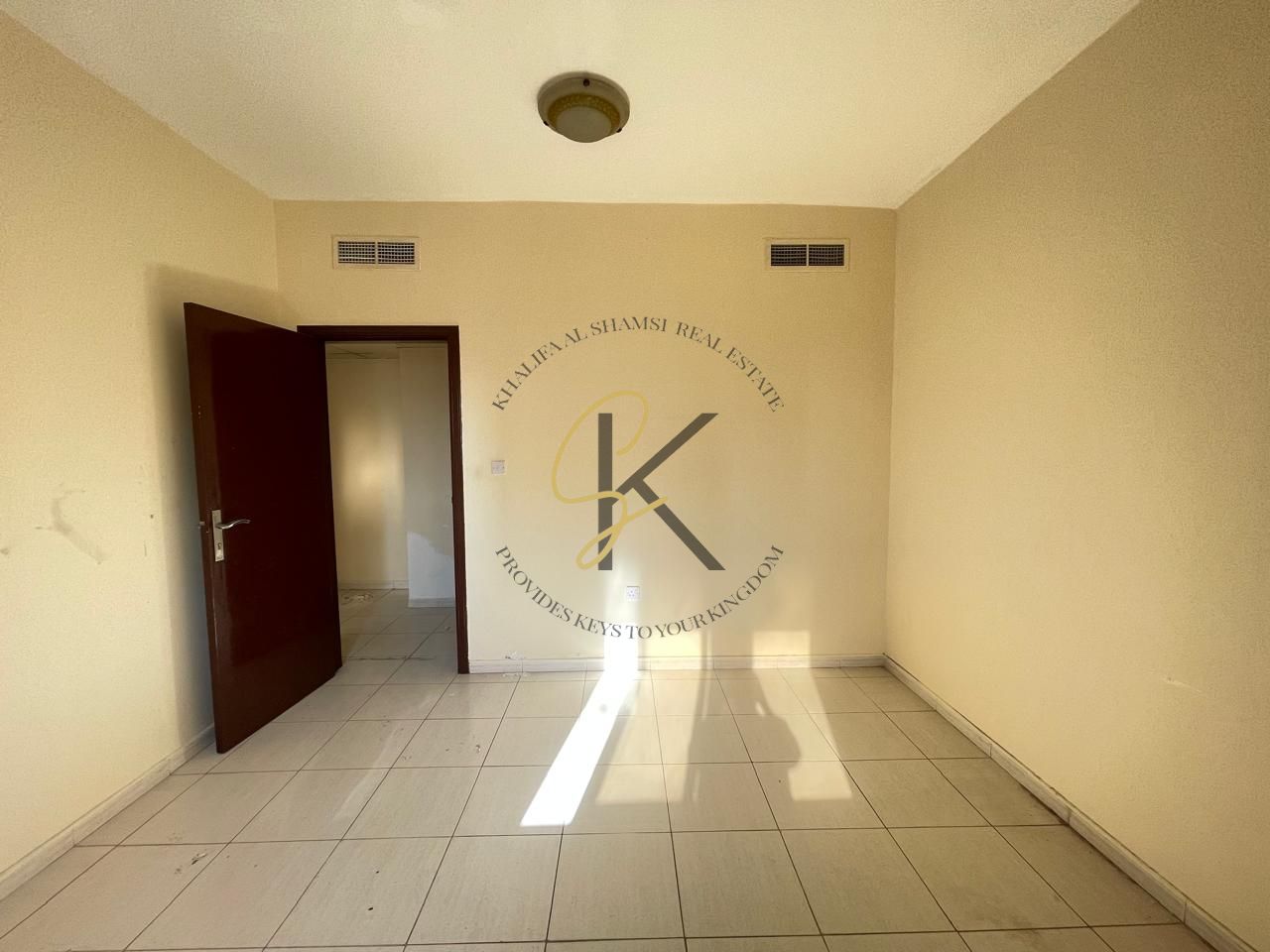 Spacious Unfurnished 2 BHK Apartment with Balcony for Rent in Muwailah, Sharjah | 2 Washrooms | Dedicated Parking | Prime Location | 1300 Sqft | All Amenities