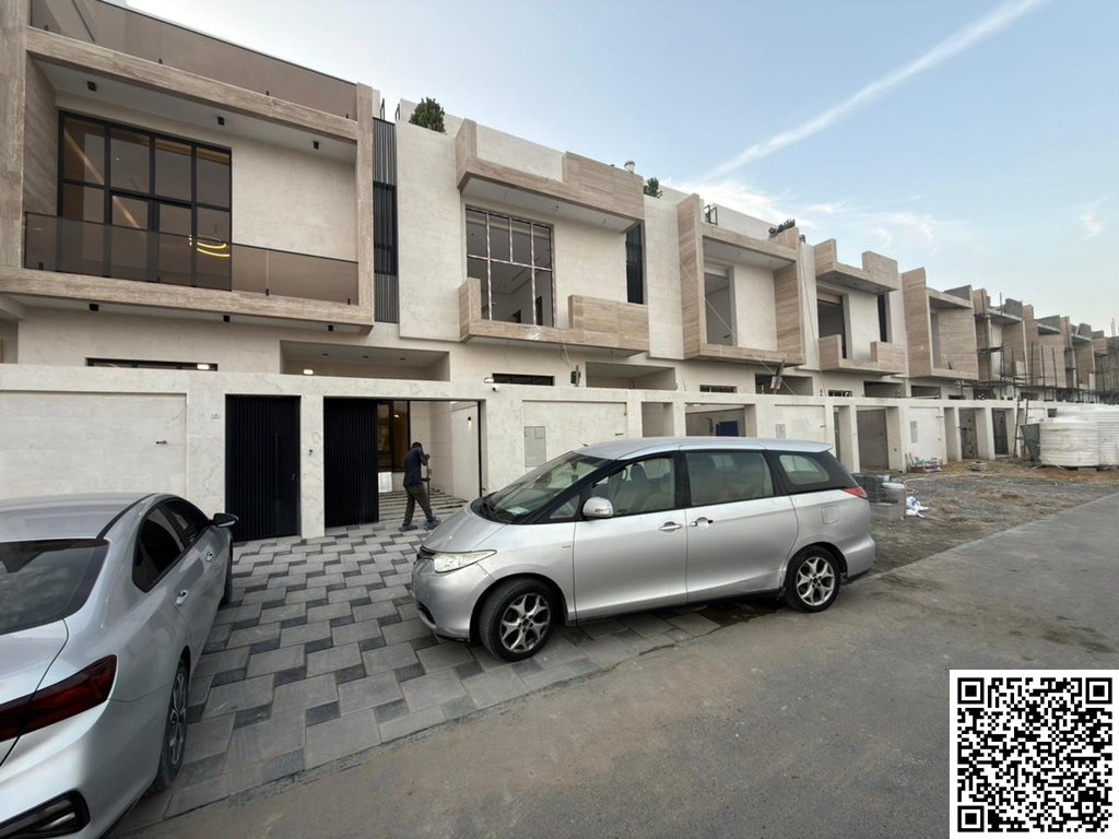 Townhouse villa in Al Yasmin, Ajman. Excellent location on a main street. Two floors and a roof. Price includes registration fees. Land area: 1750 sq