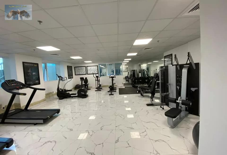 Studio for sale in Oasis Towers Ajman open view balcony private parking 520 sqft tower with gym pool garden and full security services included