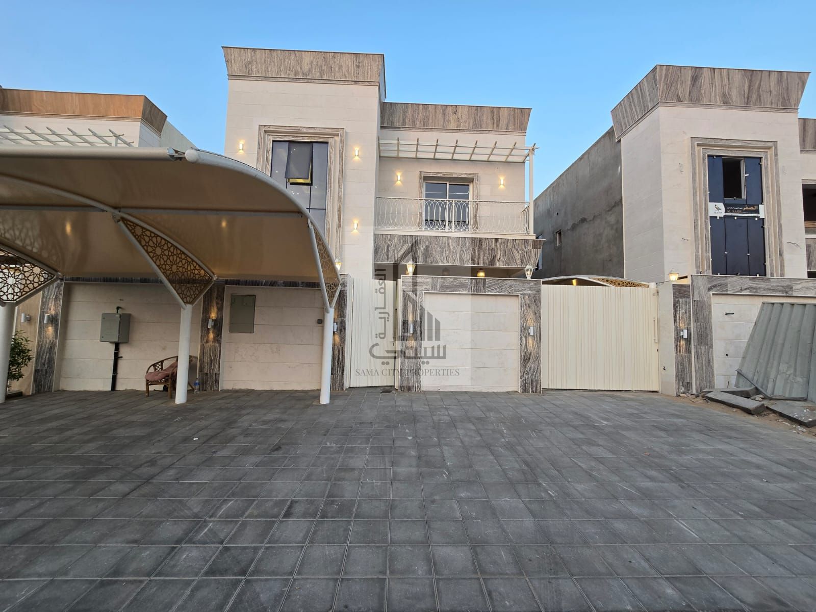 Luxury villa for sale in Ajman, including registration fees.
