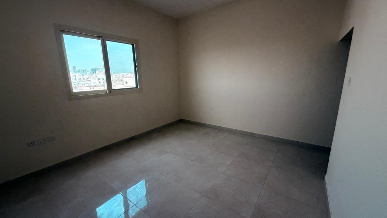 Brand new, second-occupancy studio apartment for annual rent in Ajman - Al Nuaimiya, near Safeer Mall. Located in a family-friendly building