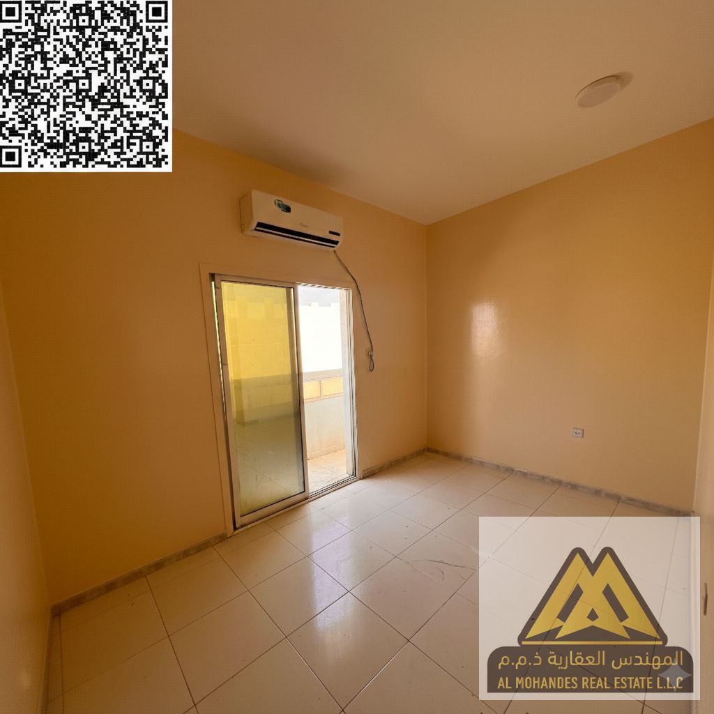 A spacious apartment available for annual rent in Al Mowaihat 2, featuring a separate living room, balcony, and a prime location close to services and