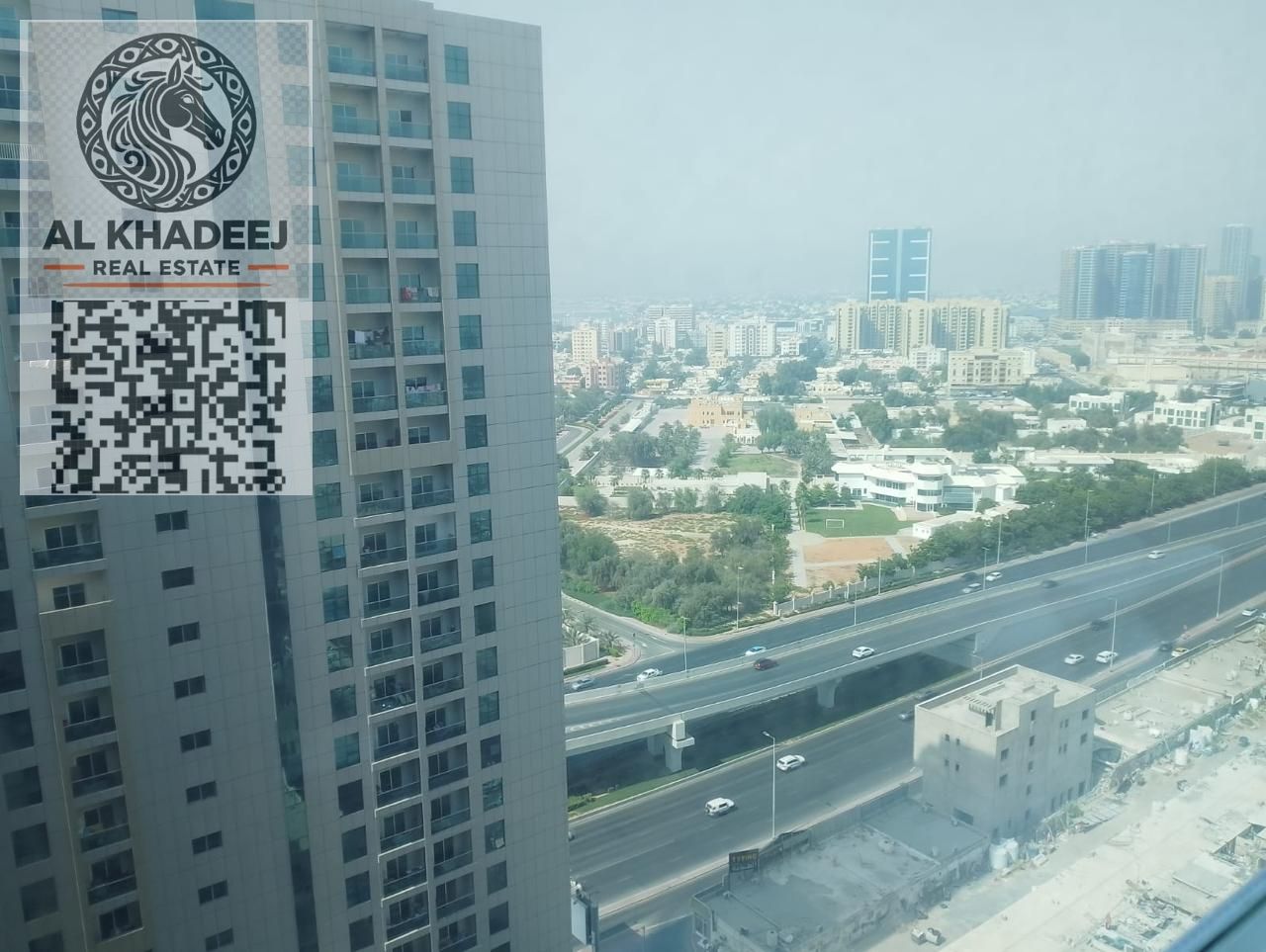 For sale: One-bedroom apartment in City Towers, with a balcony offering an open view of Safeer Mall and Sheikh Khalifa Bin Zayed Street.