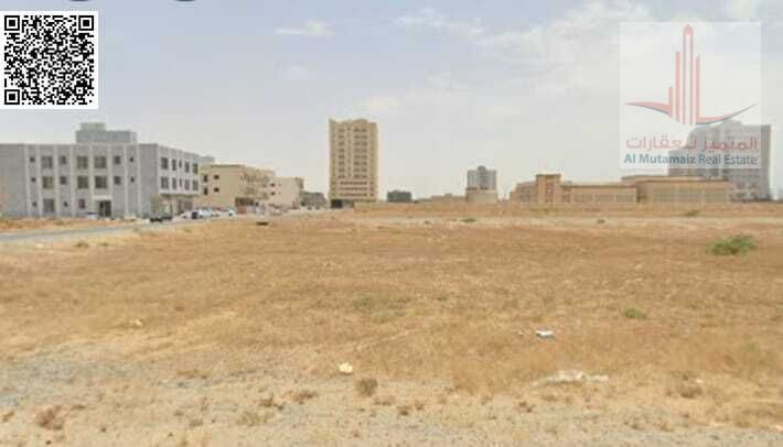 For sale in Ajman, residential/commercial land in Al Yasmeen area, corner plot on two streets, area 10,010 sq ft, permit G+10, asking price 4,500,000