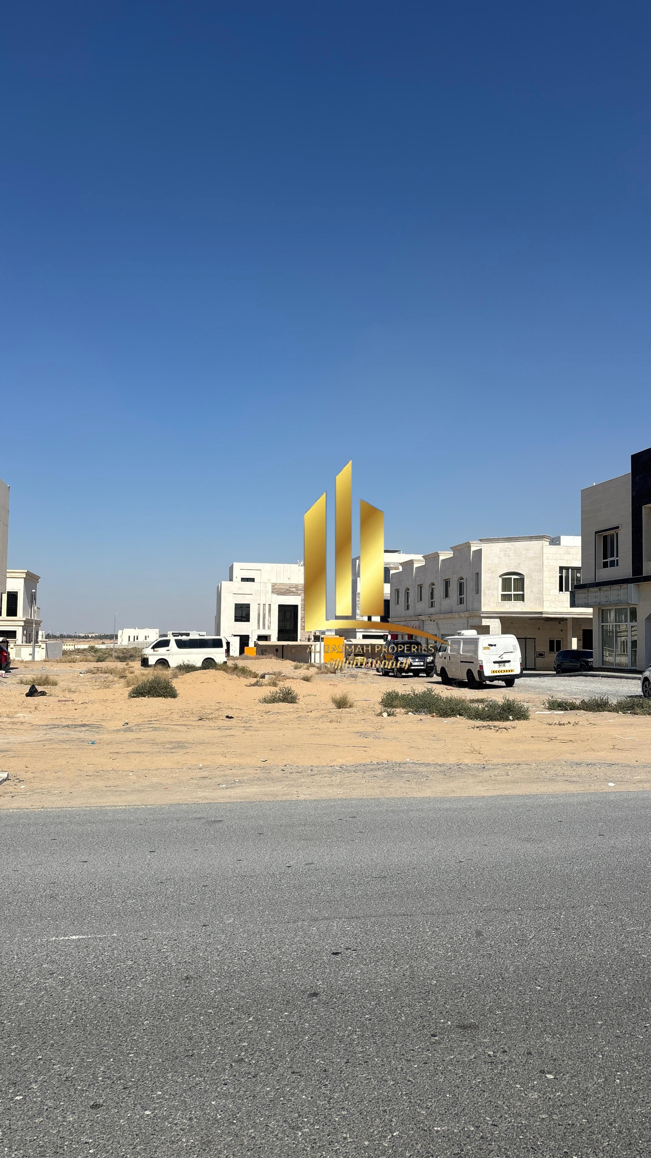 Corner commercial plot for sale in Al-Hawshi, Al-Badi'a, Sharjah.