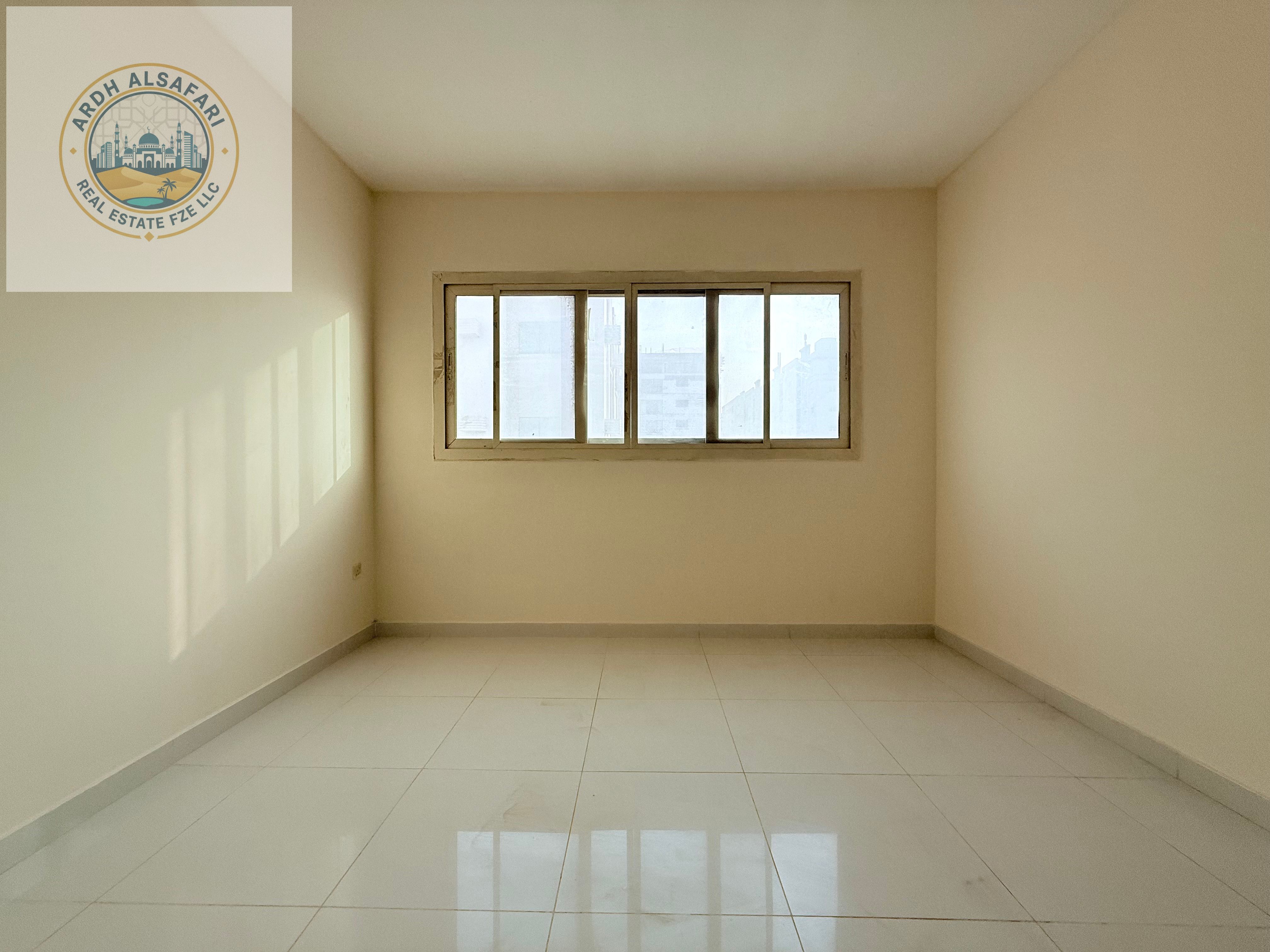 SPACIOUS ONE BEDROOMHALL // NEAR AL MADINA SHOPPING CENTRE // FAMILY BUILDING // MUWAILEH BUS STATION NEARBY// EASY ACCESS TO DUBAI