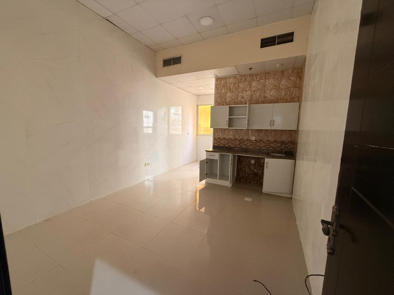 Annual Rent in Ajman Location: Al Muwaihat 3 Studio apartment with a suitable size, kitchen, bathroom, and central air conditioning Price: