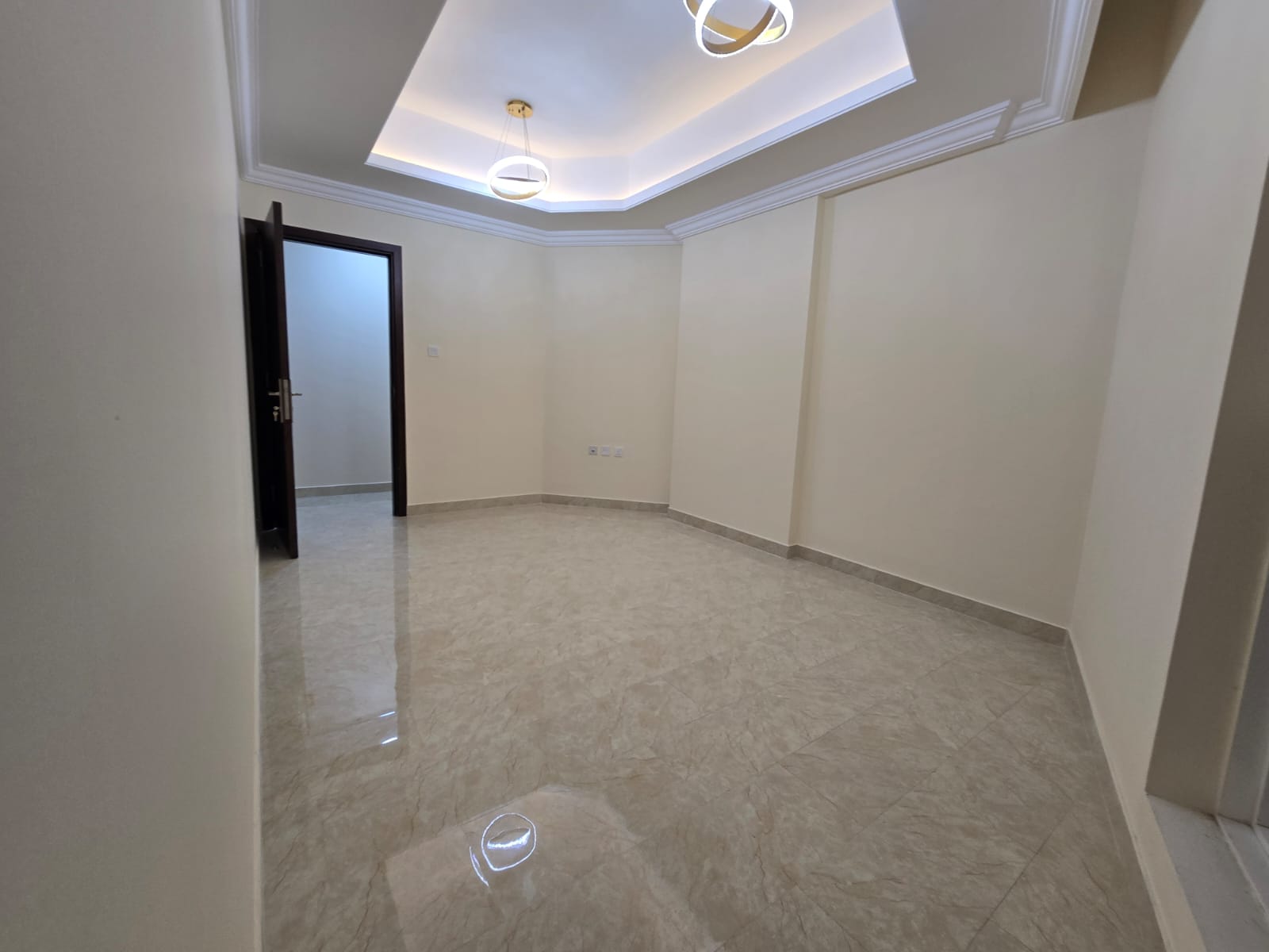 A three-bedroom apartment with a living room is available for rent in Al Rawda, Ajman.