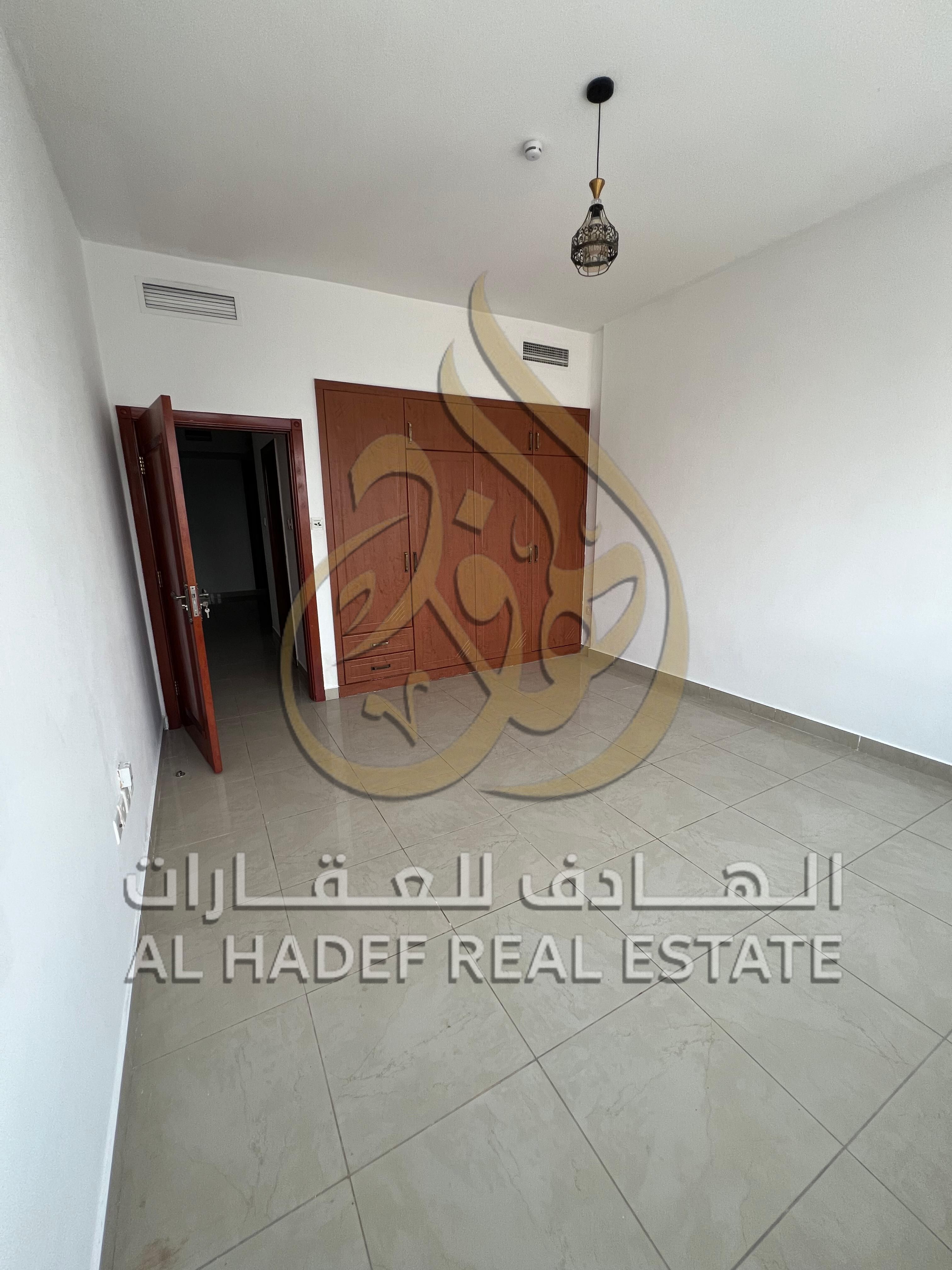 Sharjah Emirate, Al Majaz 3 area, available two-bedroom apartment with a hall, balcony with direct sea view, wall closets, parking, gym, swimming pool