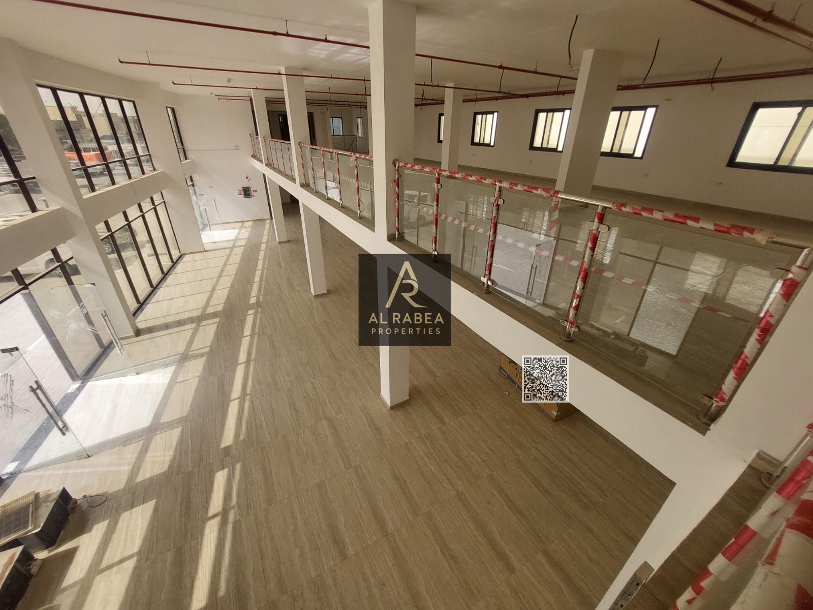 Luxury commercial showroom for rent in Al Jurf Industrial Area, 8300 sq ft, high electricity, and private parking.