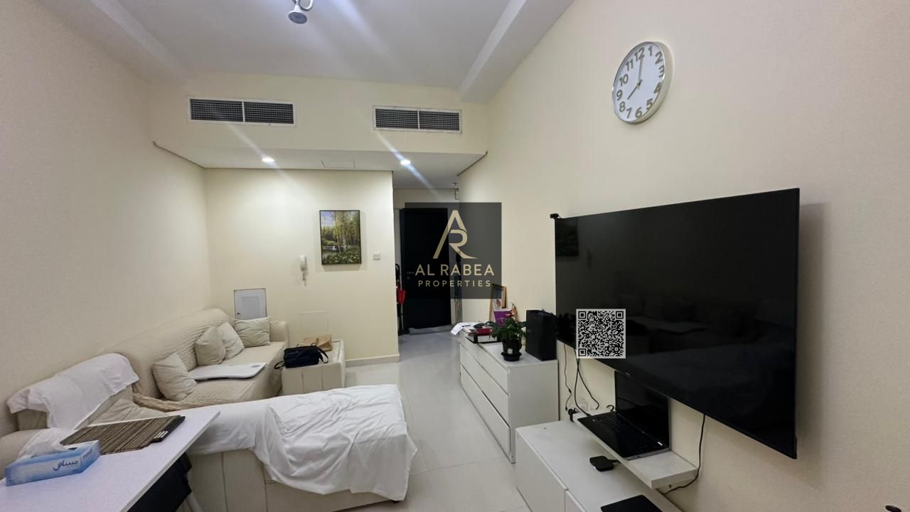 A beautifully designed apartment for sale in Emirates City, featuring a spacious layout, large living room, balcony, and stunning views.