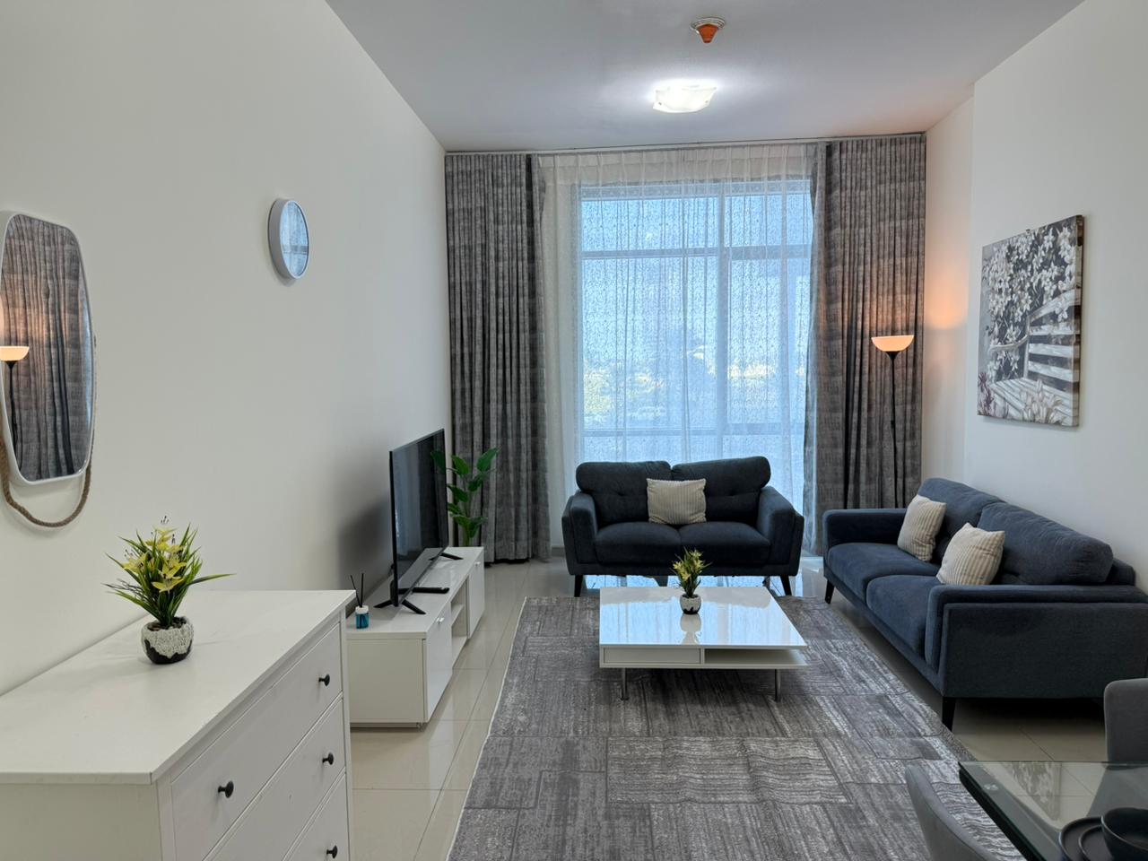 Furnished one-bedroom apartment with hotel-style furniture and a sea view for monthly rent in a prime location in Ajman.