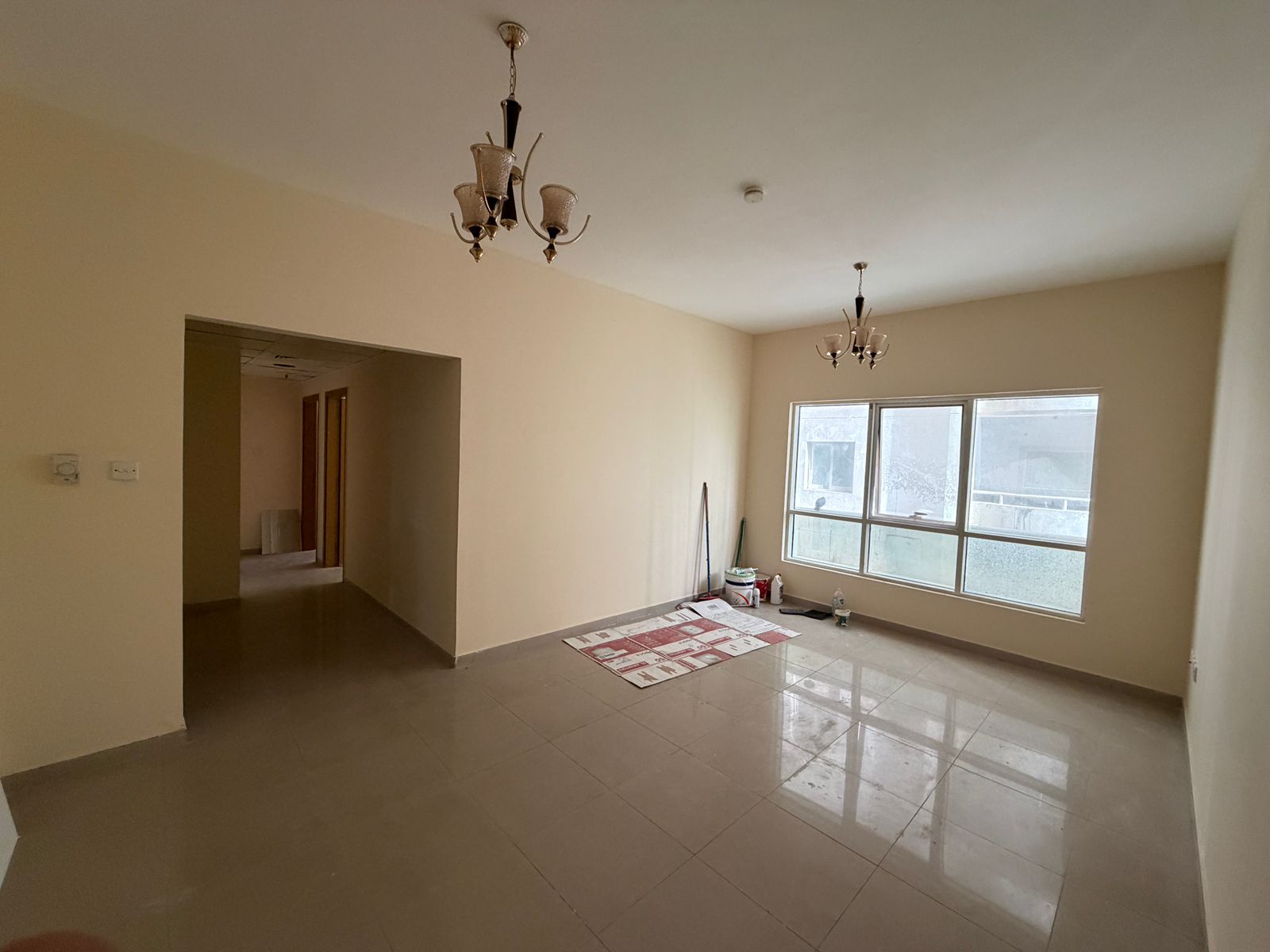 2BR + living room, central AC & gas, 1 month free, deposit by cheque, family building, spacious, near Al Istiqlal St, easy Dubai & Ajman access.