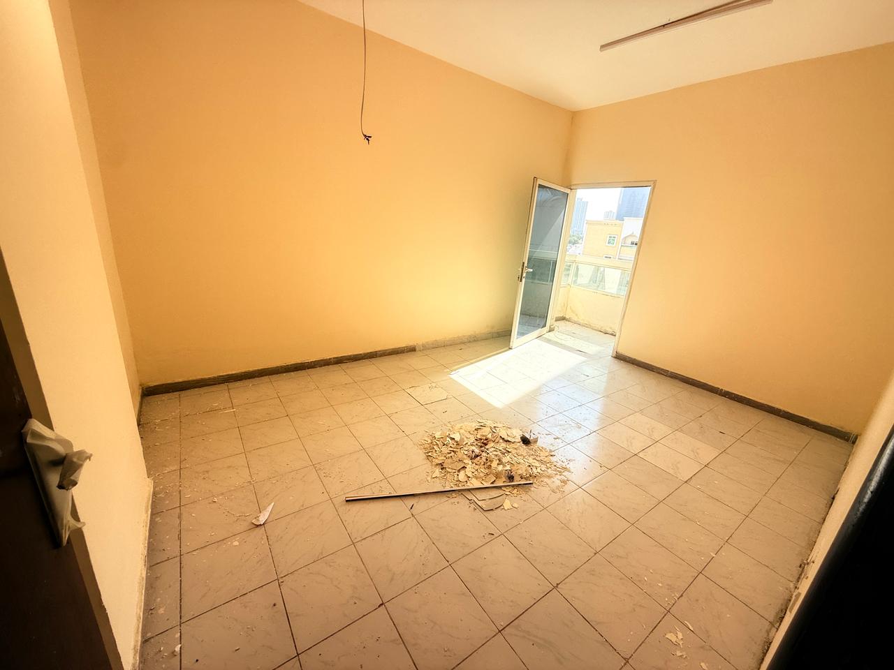 Two bedrooms, living room, bathroom, excellent space, prime location in Al Rashidiya