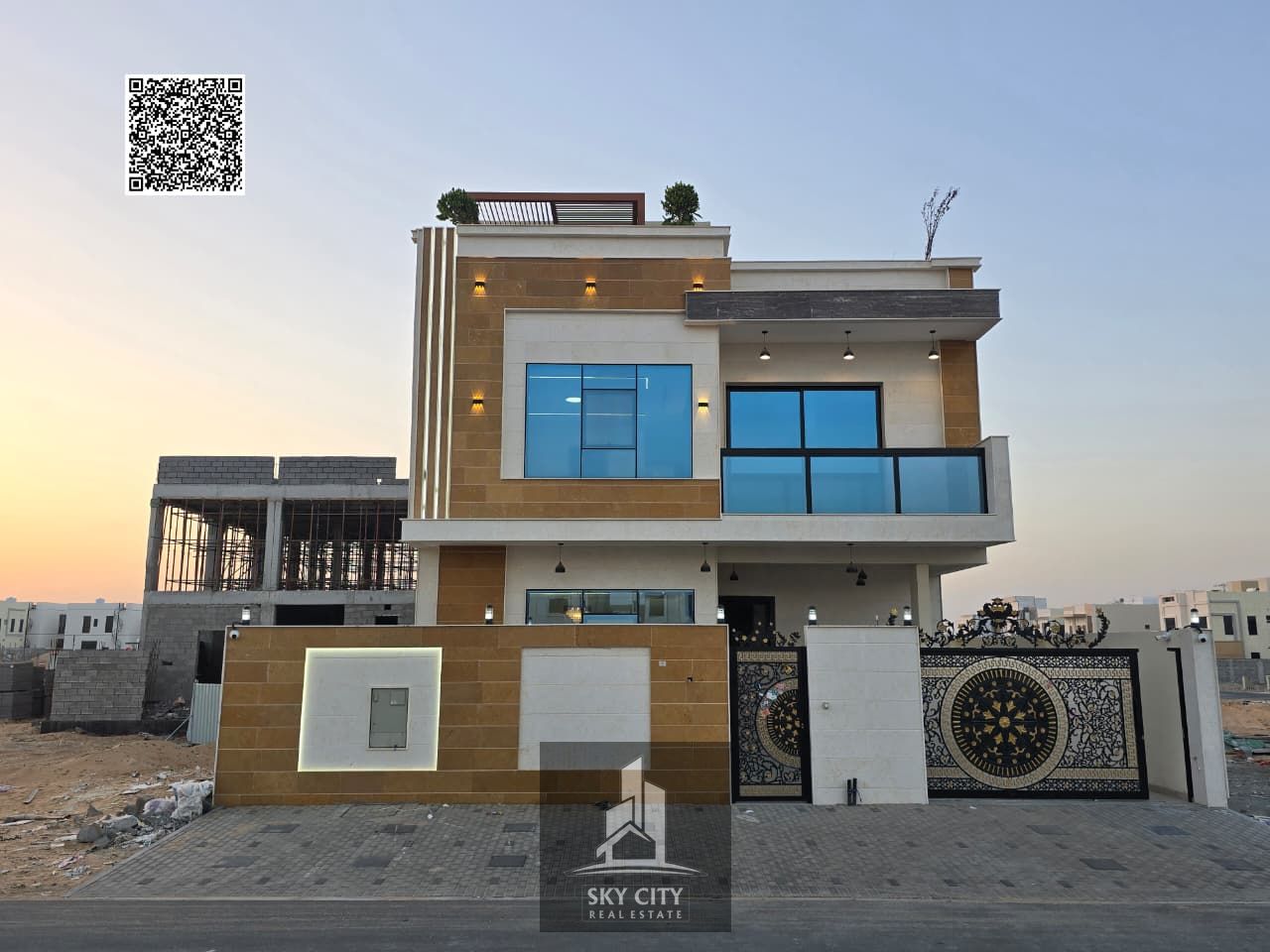 For Sale: Two-story villa with a roof terrace, featuring a large yard and a spacious courtyard. Price negotiable. Located near Sheikh Mohammed Bin Zay