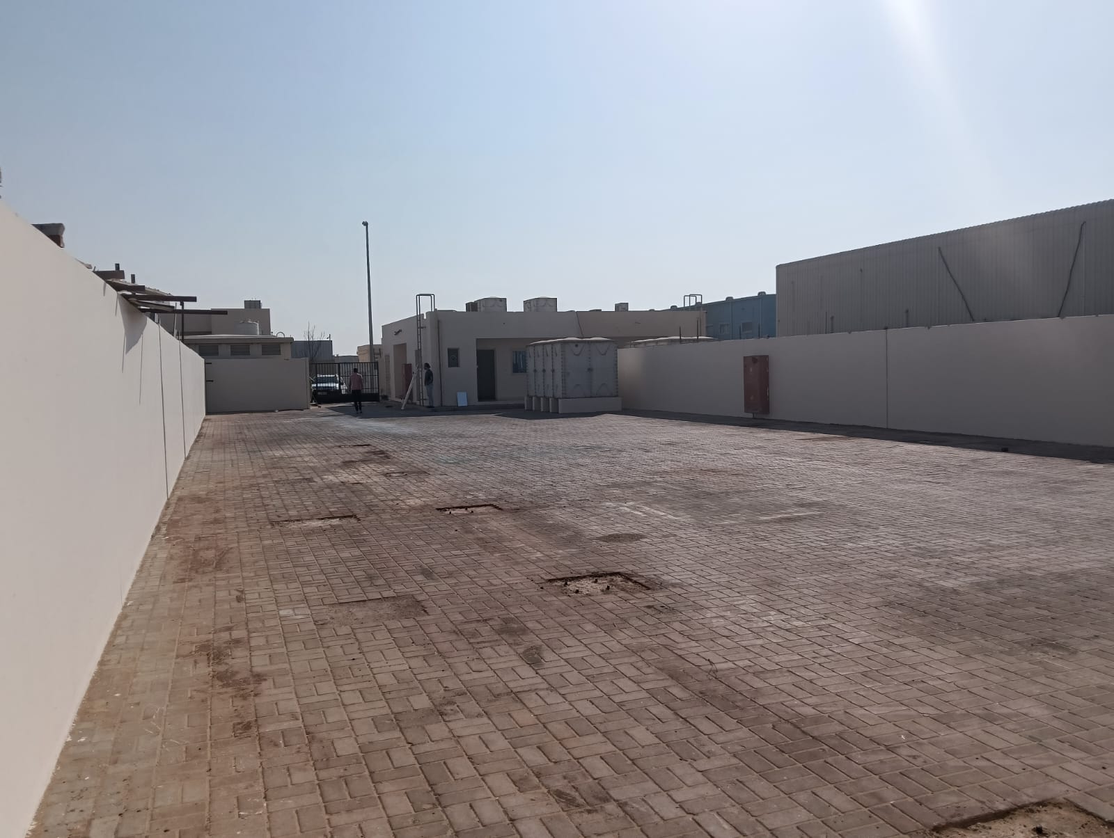 A High-Demand Investment Opportunity in the Scrap Area _ Fenced Open Yard Land for Sale in Sajaa – Al Hanou