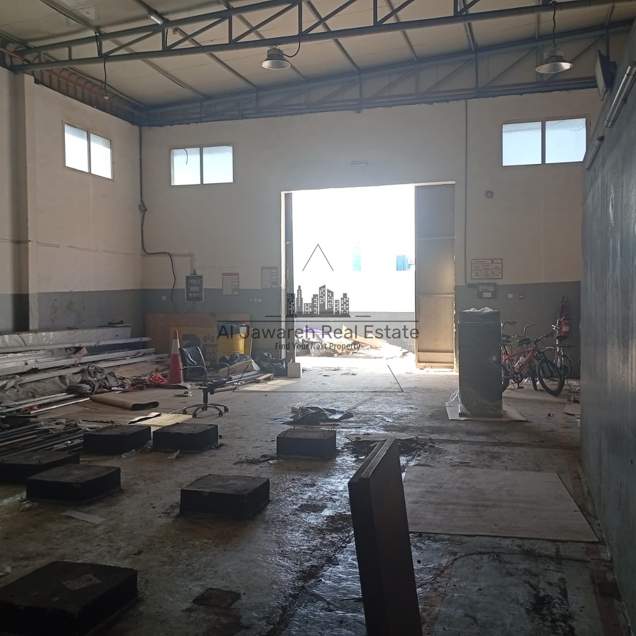 For annual rent, two adjacent warehouses in Umm Al Quwain, Code 3128, located in a strategic and active industrial area close to all essential service