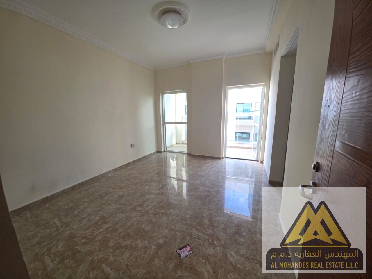 Spacious 2-Bedroom Apartment with Living Room for Rent – Family-Friendly in Al Rashidiya, Prime Location