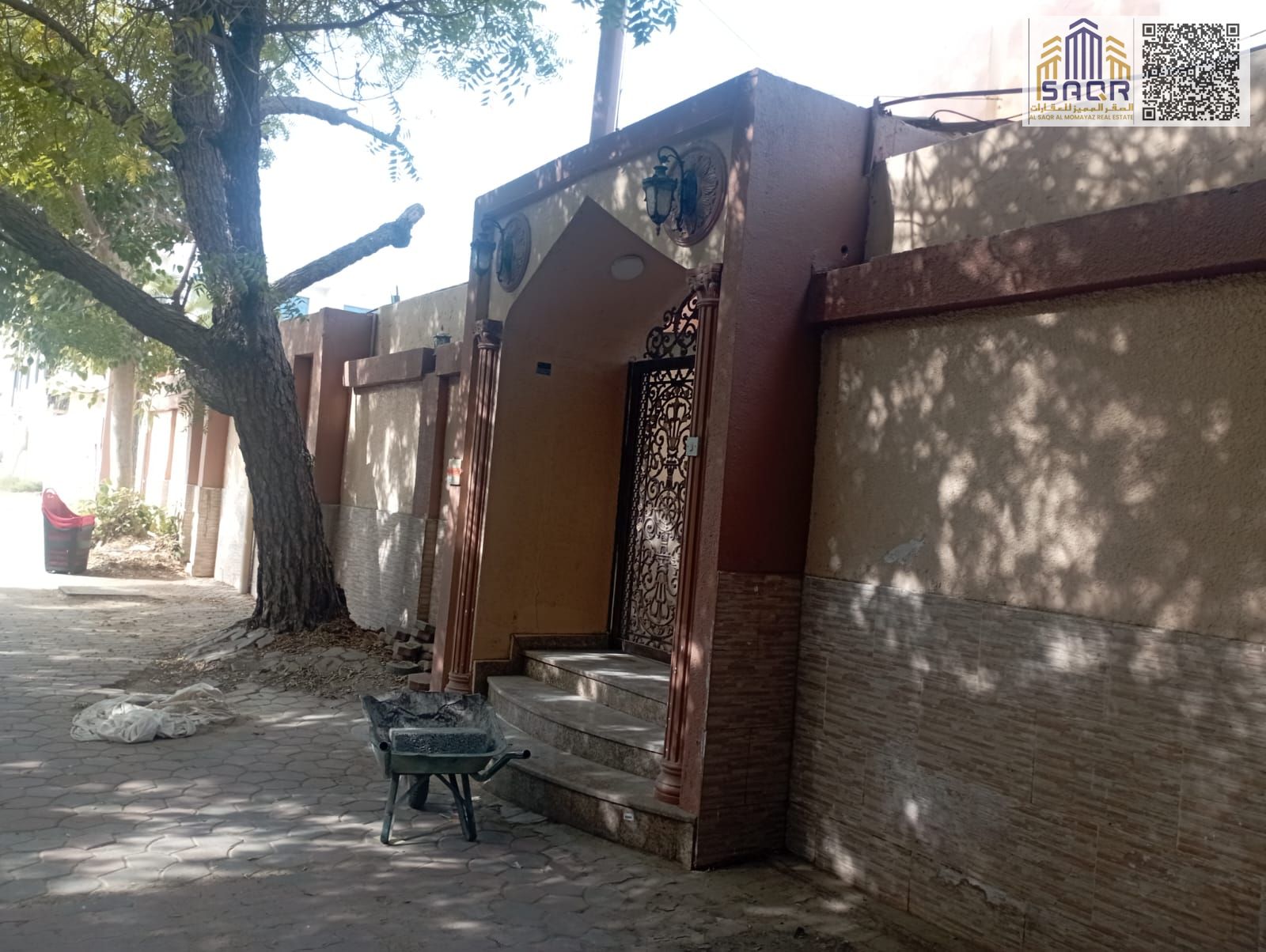 Villa for Rent in Al Rumaila 2 Spanning 10000 sq ft Luxurious Design Open Spaces Spacious Rooms Multiple Living Areas Prime Location