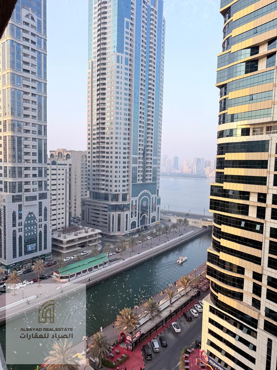 For sale: a two-bedroom apartment with living room in Al Majaz 3, Al Qasba area. Area 1,150 sq. ft. , with one parking space. Price AED 650,000.