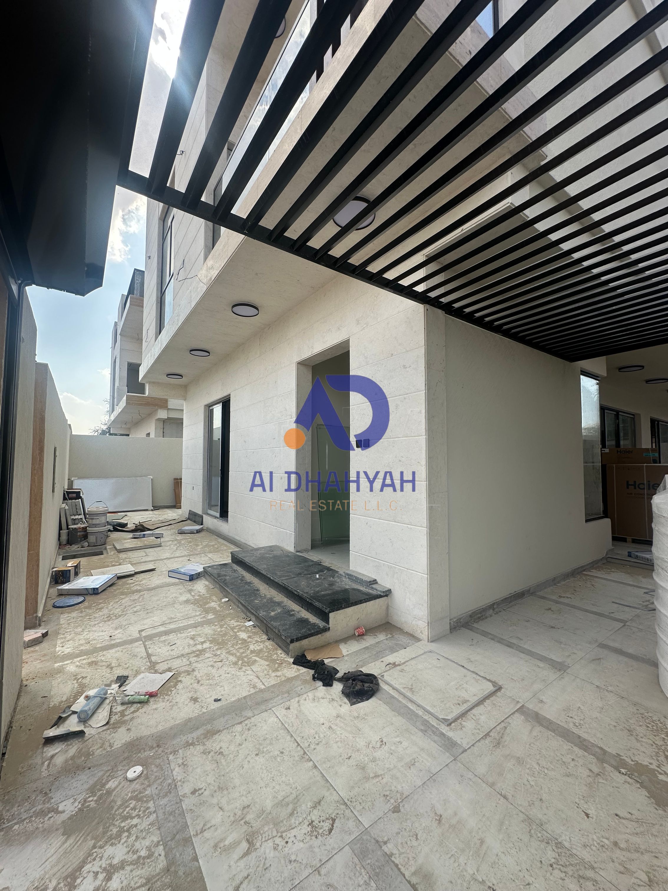 Luxury villa for sale in Al Helio 2, Ajman. G+2 with roof, 5 master bedrooms, pool, large yard, central AC, prime location on main road.