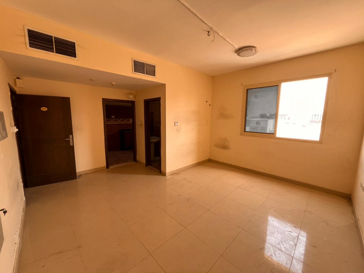 Large studio apartment with separate kitchen, central air conditioning, and full maintenance included by the owner. Prime location in Al-Jarf 2.