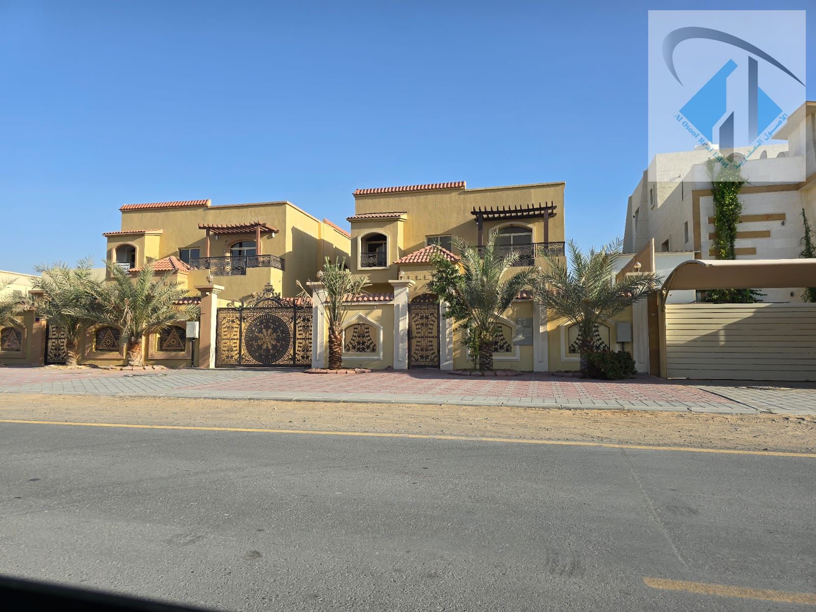 Villa for sale in Ajman, including electricity, water, and air conditioning. The villa is located on a commercial street.