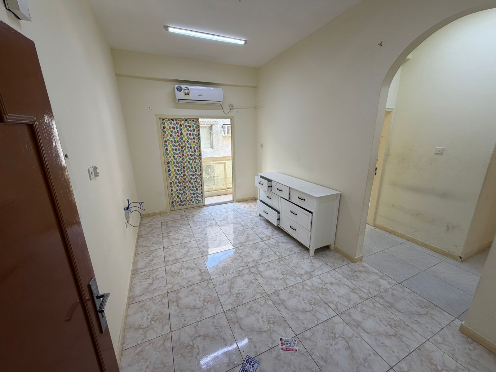 Two-bedroom apartment with a living room and balcony, unfurnished, available for monthly rent in a very prestigious and prime location.