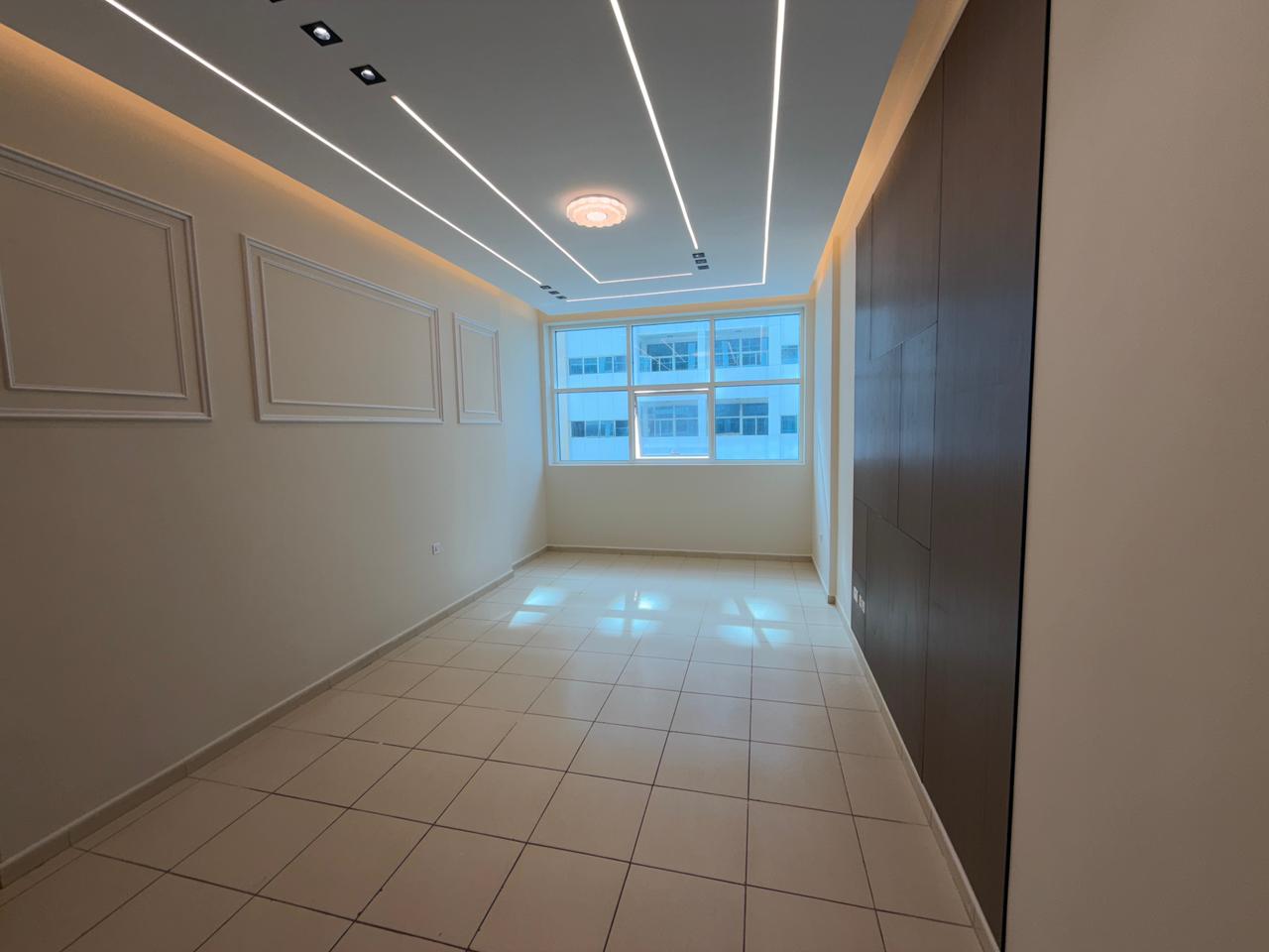 Two bedrooms and a living room in Ajman Towers One, super deluxe finishing