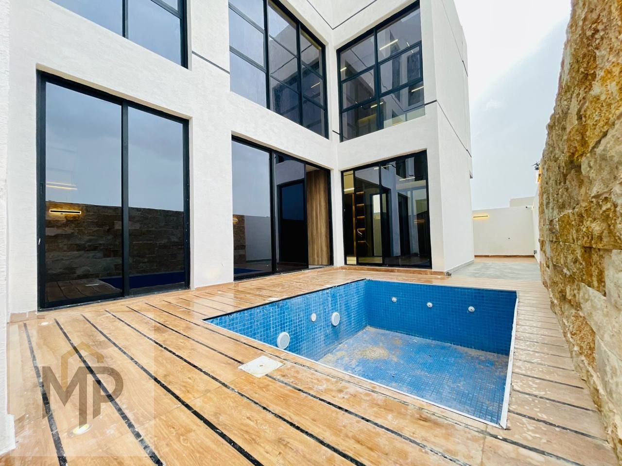 Villa with pool for sale in Al Bahia, Ajman. Excellent location, registration fees included, freehold.