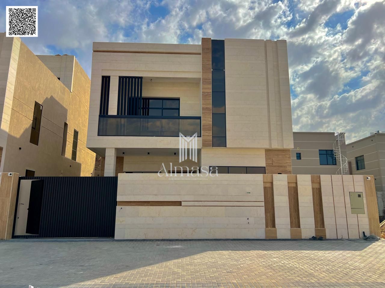 Two-story villa with a roof terrace, European design, high-end finishing, prime location opposite Al Hamidiya Park and close to Mohammed Bin Zayed Roa