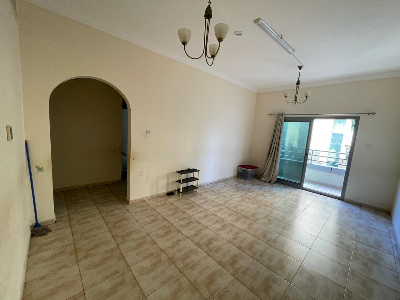 2BR + living room, central AC & gas, balcony with view, family building, spacious layout, near King Faisal St, easy access to Dubai & Ajman.