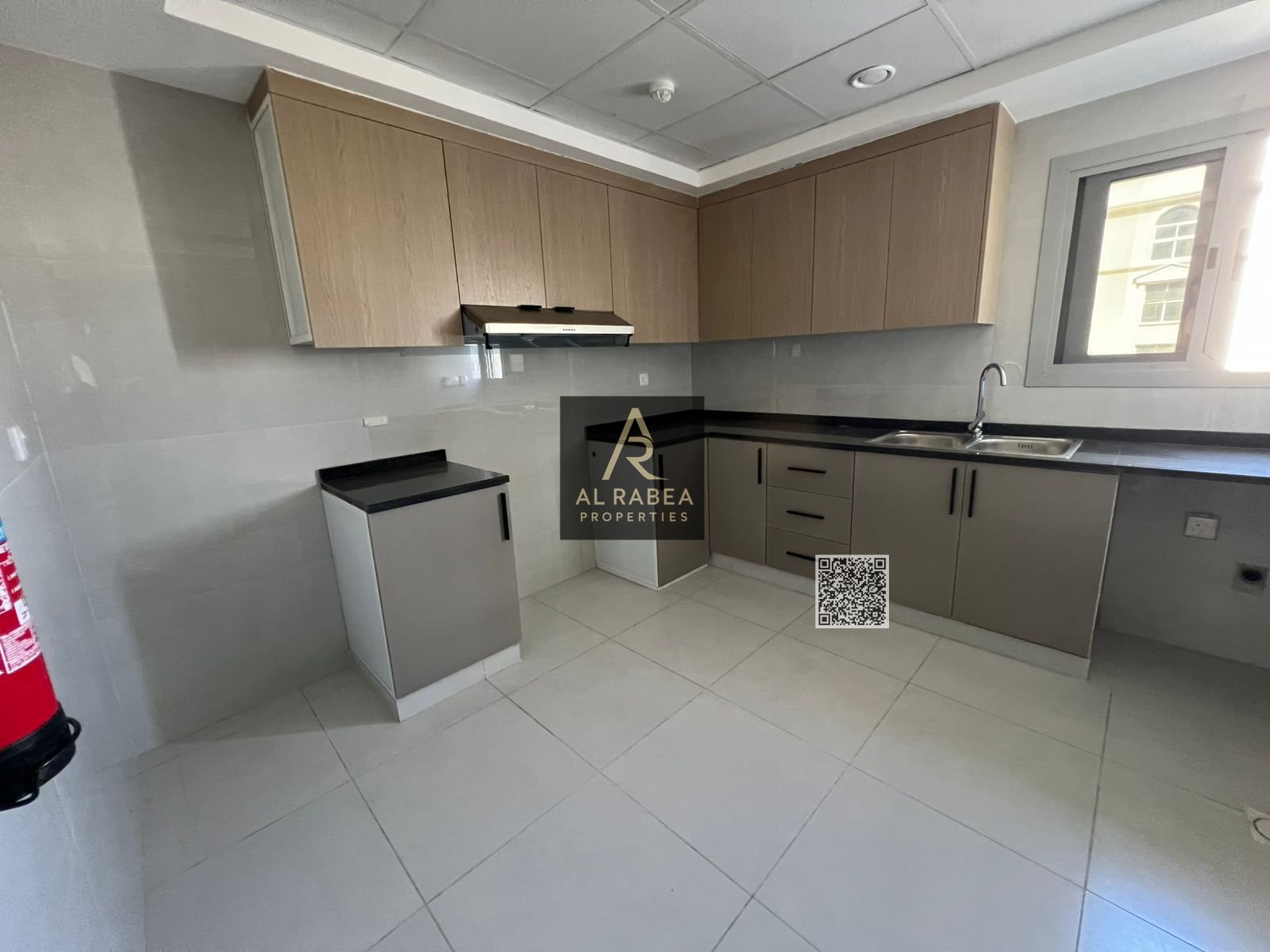 Two bedrooms, a living room, three bathrooms, and built-in wardrobes in Al-Jarf 2