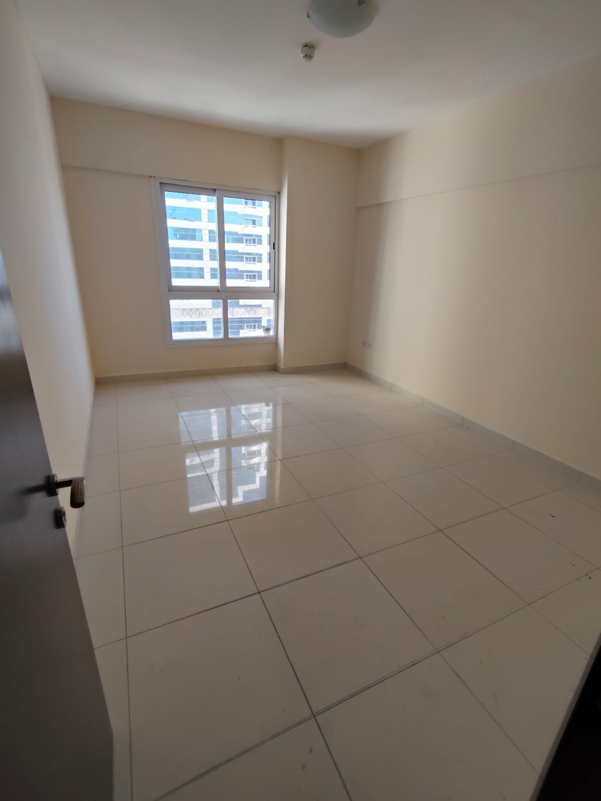 Free month 2BR apartment with living room, 2 bathrooms, central AC, prime location in Al Taawun near the Corniche.