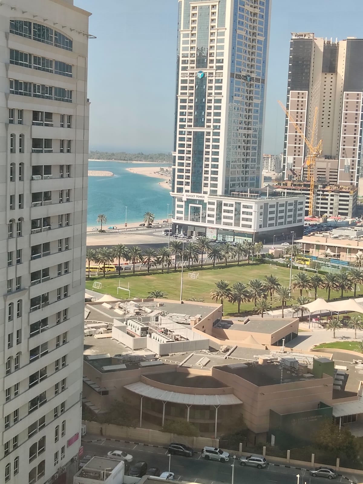 Free month Spacious 1BR apartment with stunning sea view, prime location in Al Taawun near the Corniche.