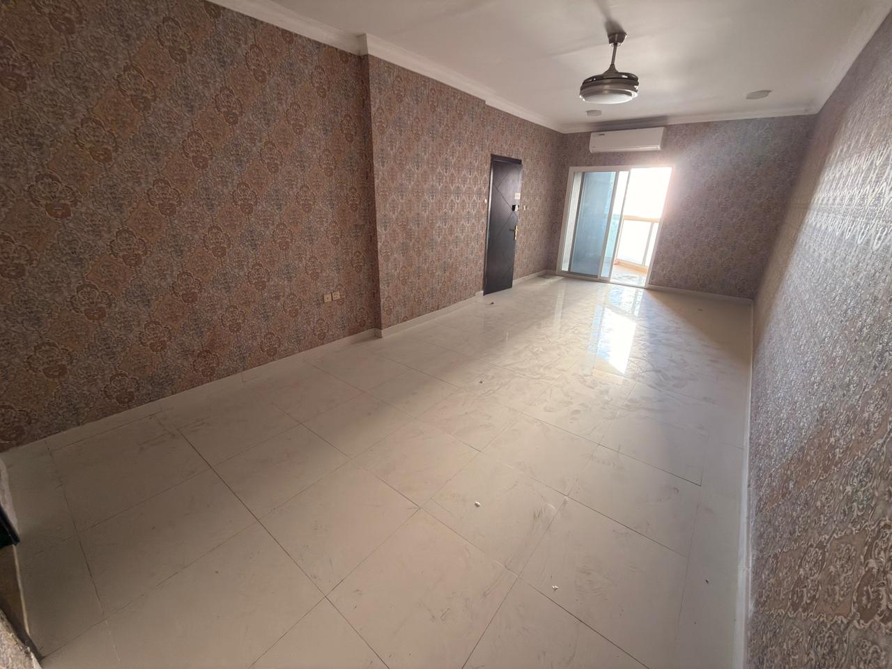 For annual rent: Two-bedroom apartment with a living room in Al Jurf 2, Ajman. Largest available space with two balconies.