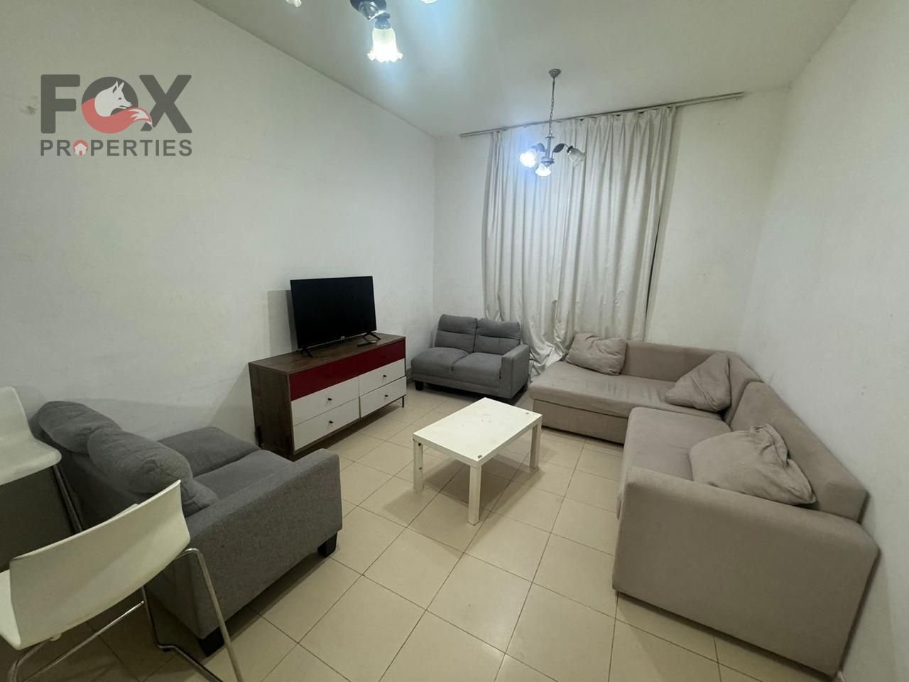 A fully furnished one-bedroom apartment with a living room is available for annual rent, featuring a practical design and a comfortable space.