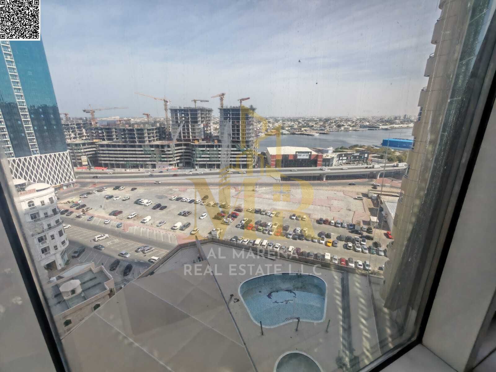 Apartment for sale in Al Rashidiya 1, Horizon Towers, near Nesto Market and Al Safeer Mall. It features two bedrooms, three bathrooms, a spacious livi