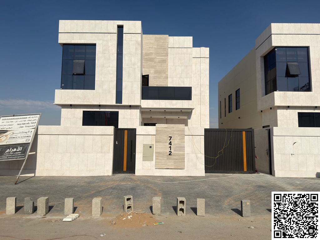 Modern villa for sale in Al Helio 2 area, Ajman. Excellent location on a main street. Two floors. Price includes registration fees. Land area: 3014 sq