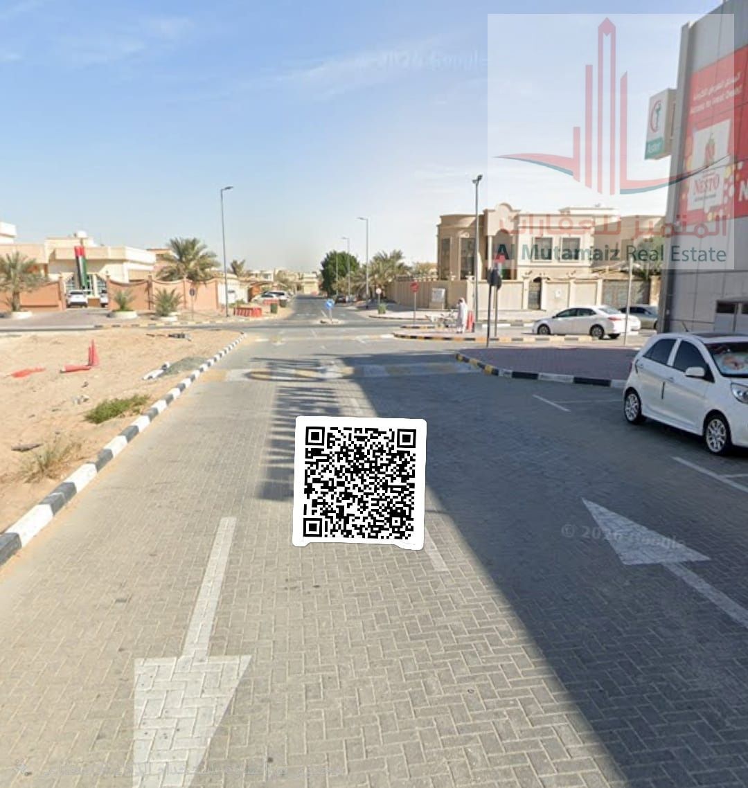Residential/commercial land for sale on the main street opposite Nesto Hypermarket in Al-Hamidiyah area