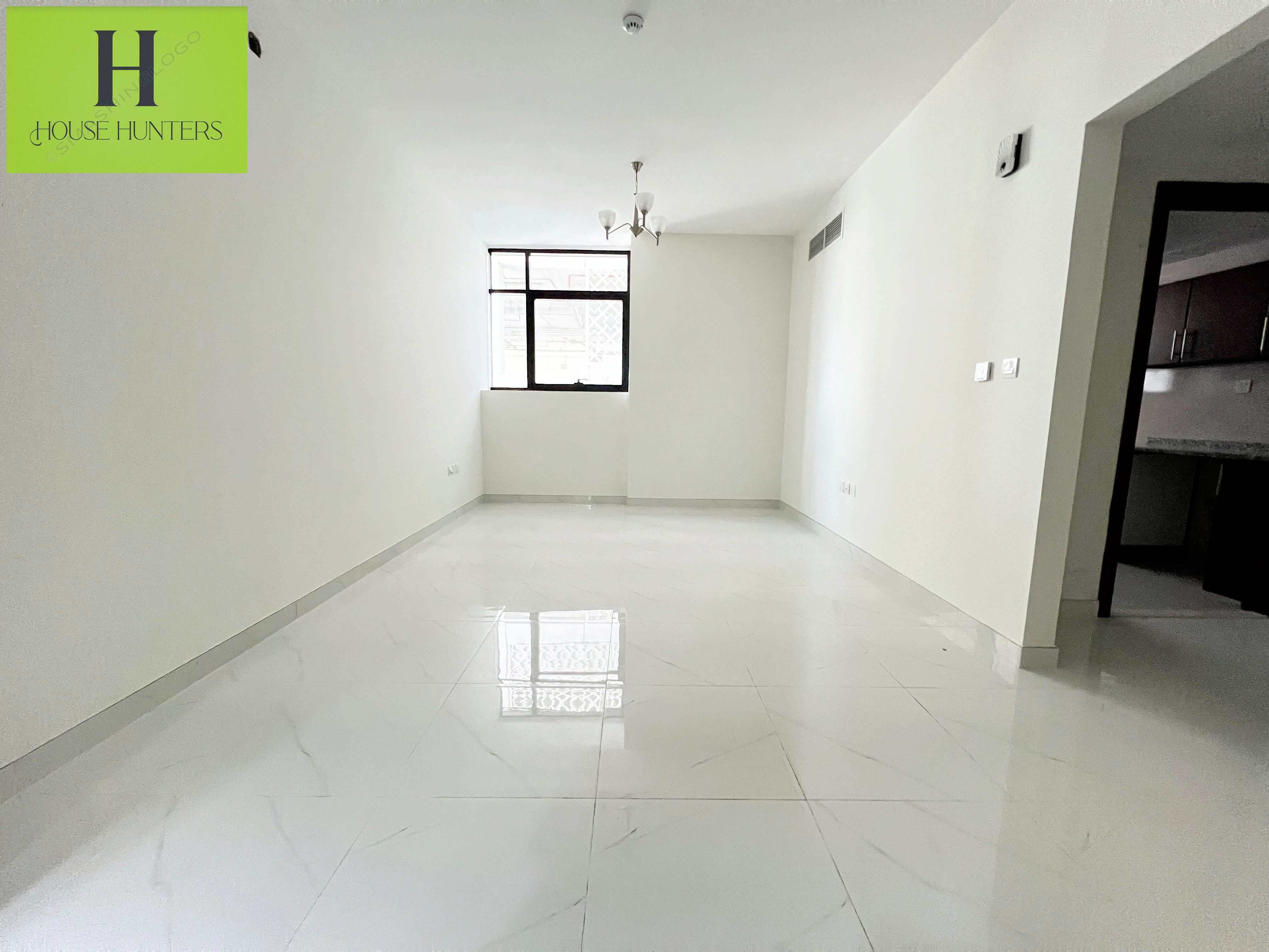 Brand-New Building Big Space Master room Maintenance Free one Parking Free Exit To Dubai
