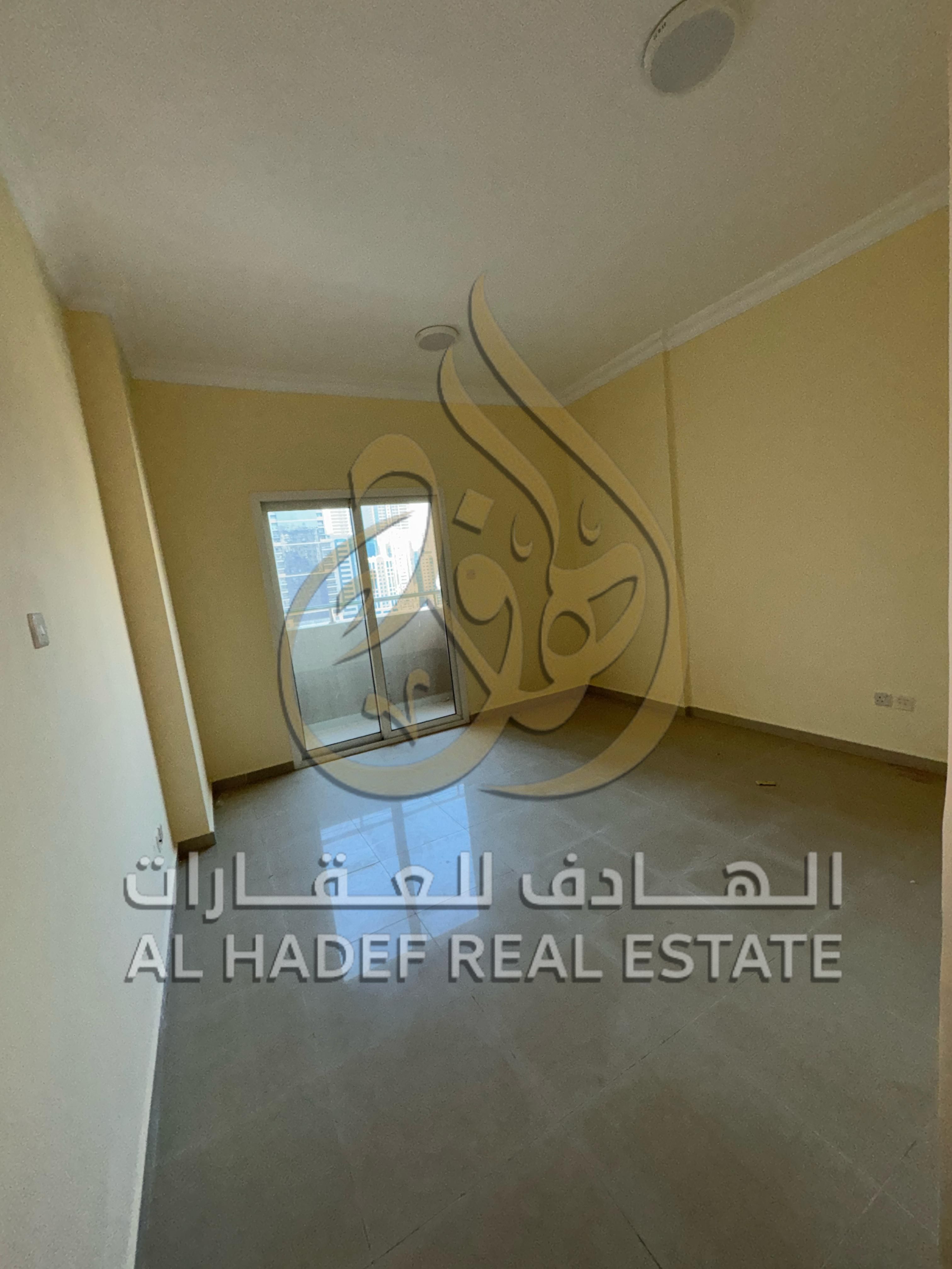 Two bedrooms and a living room + maid's room + with parking and one month free balcony in a strategic location in Al Nahda