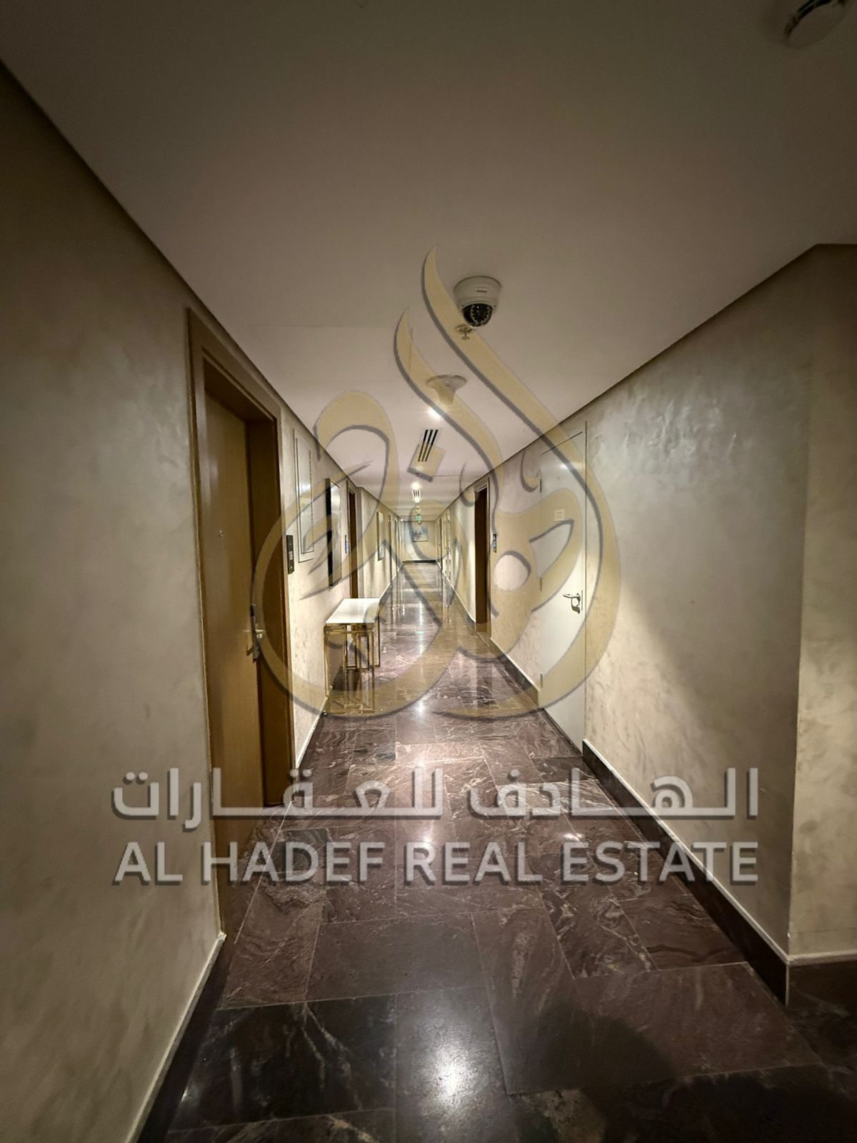 Two-bedroom apartment with a living room, free air conditioning, annual rent in a prime location in Al Taawun area, next to Oriana Hospital.