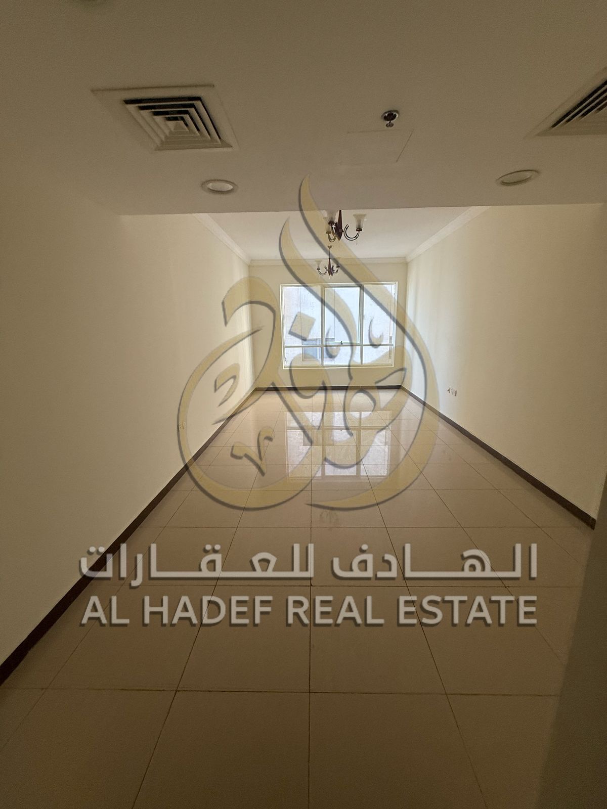 Two-bedroom apartment with a living room, parking, and one month free, in a strategic location in Al Qasimia area, suitable for families.