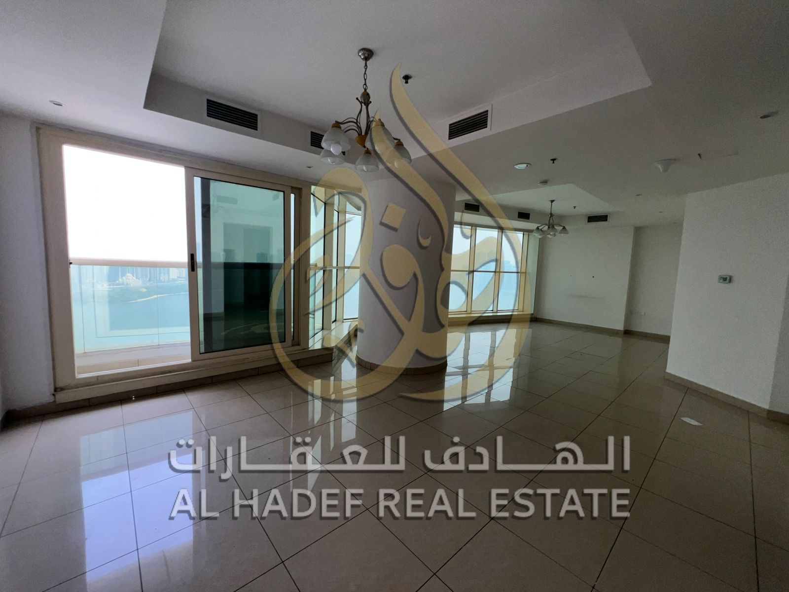 Two-bedroom apartment with a living room, free air conditioning, free parking, and a maid's room, in a strategic location in Al Majaz 3 area.