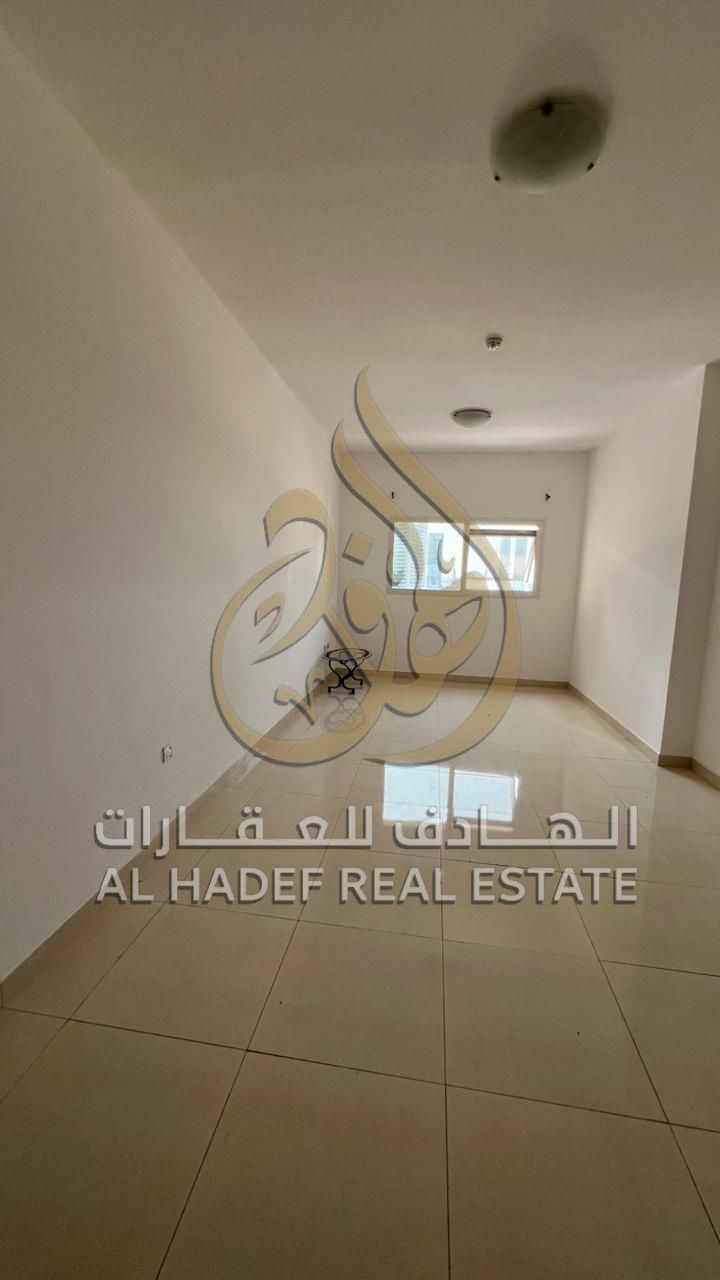 Two-bedroom apartment with a living room in a strategic location in Al Majaz 2 area, suitable for families looking for comfortable and fully serviced